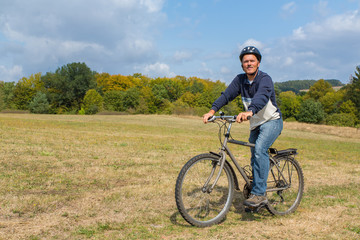 Fototapeta premium Dutch man on mountain bike in nature