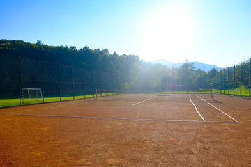 View to tennis court over autumn mountains landscape