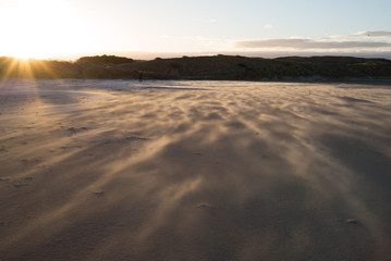 Windswept sand at dusk