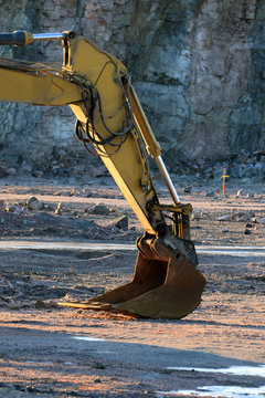 xcavator dipper boom in open pit. 