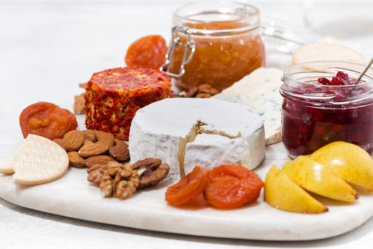 assortment of snacks, cheeses, nuts and fruits
