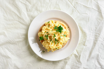 Scrambled eggs on bun