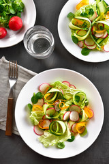 Vegetable salad from zucchini, radish, greens