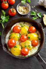Fried eggs with tomatoes