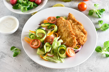 Vegetable salad and schnitzel