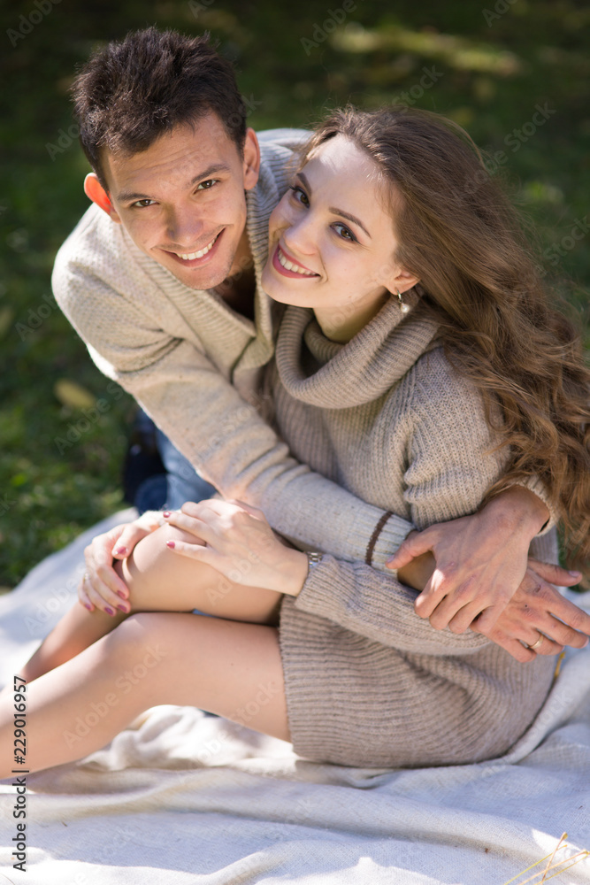 Wall mural young couple in autumn park