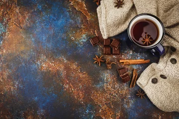 Afwasbaar Fotobehang Thee Hot winter tea with cinnamon stick and chocolate