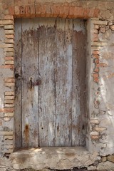 old wooden door in wall