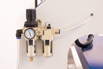Pneumatic valve meter or pressure control machine.