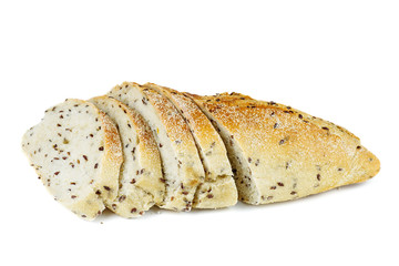 Sliced wholegrain french baguette with flax seeds on a white background