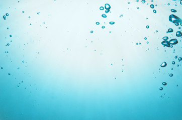 Blue water bubbles air.