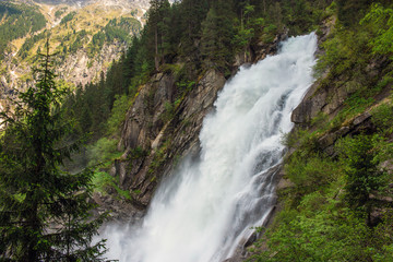 Fototapeta na wymiar View Alpine inspiring Krimml waterfall in mountains in summer day. Trekking in National park Hohe Tauern, Austria