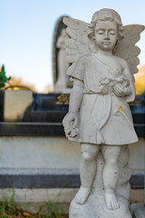 statue of child on cemetery