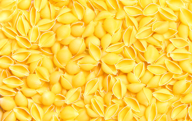 Uncooked macaroni background. Pasta texture.