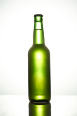 Filled green beer bottle. Isolated on white background.
