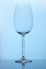 Empty wine glass. Blue lighting. Close up.