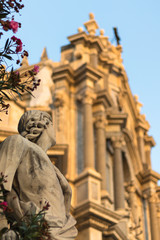 Fototapeta na wymiar statue in front of cathedral facade in catania italy