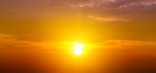 Fototapeta premium Cloudy sky and bright sun rise over the horizon.