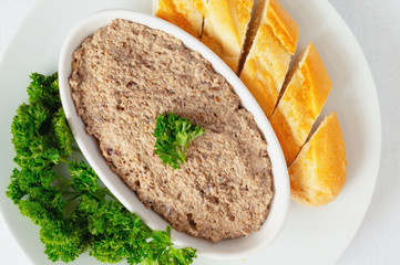 mushrooms paste made with onion, garlic, cream cheese and brendy served with bread and parsley 