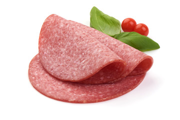 Thinly sliced salami with basil leaves, close-up, isolated on a white background.