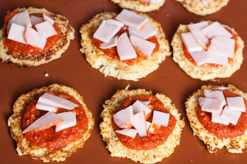 Preparation of paleo cauliflower pizza with ham