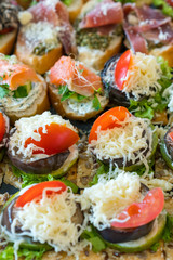 Gourmet appetizers: caviar, venison, tuna and salmon. gastronomic background. vertical photo