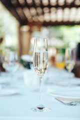 One glass of champagne in the restaurant on the table