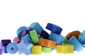 pieces made of eva rubber of various shapes and bright colors piled
