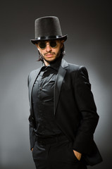 Vintage concept with man wearing black top hat
