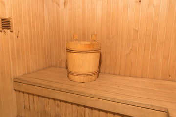 wooden container for cold water is in the bath