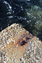 Rusty metal and stone