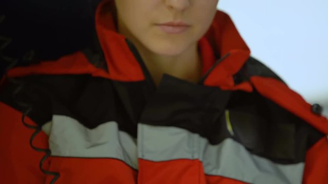 Female doctor responds by radio in ambulance, doctor on-duty drives out on call