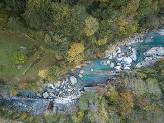 Aerial drone shot from above of hiking Trail at the famous Roman Bridge called Ponte dei Salti in Lavertezzo,Verzasca Valley,Ticino Canton,Switzerland