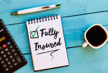 Text Fully Insured on notebook Concept