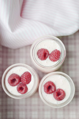 yogurt jars and fresh raspberries