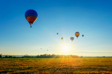 Fototapeta premium Many balloons at sunrise sky background