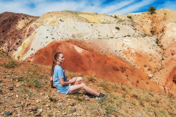 Woman in valley of Mars landscapes in the Altai Mountains, Kyzyl Chin, Siberia, Russia