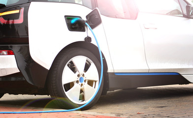 Electric car charging with a charger socket