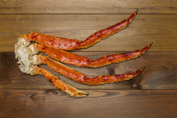 Crab claw on wooden background