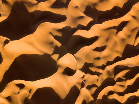 Aerial Top View On Sand Dunes In Desert