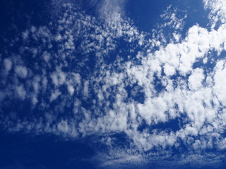 White fluffy clouds in the blue sky