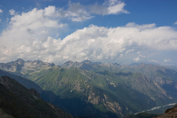 Naklejka premium Closeup view mountains scenes in national park Dombai, Caucasus, Russia, Europe. Summer landscape, sunshine weather, dramatic blue sky and sunny day