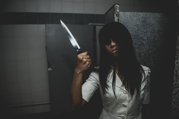 Portrait of asian woman make up ghost face with blood,Horror scene,Scary background,Halloween...