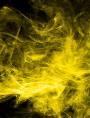 Yellow smoke on black background