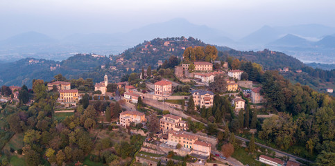 Fototapeta na wymiar Bergamo, Italy. Drone aerial view of the hill of San Vigilio during sunrise