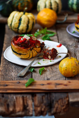 Meatball-stuffed squash with tomato sauce.selective focus