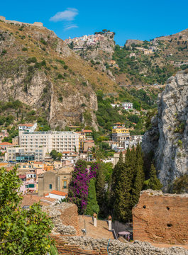 Ruins of the Ancient Greek Theater in Taormina with Castelmola village in the background. Province of Messina, Sicily, southern Italy.