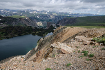 Beartooth Highway Pass in Montana on a sunny summer day featuring an alpine lake.