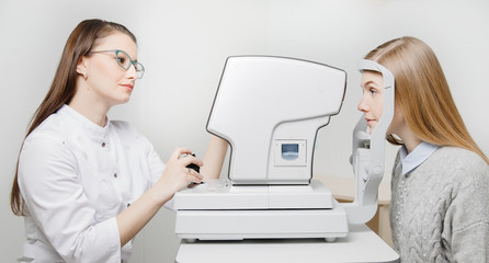 Ophthalmology, ophthalmologist doctor diagnostic exam patient woman eyes on lamp slit.
