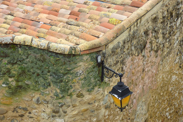 Vintage style street light on stone wall